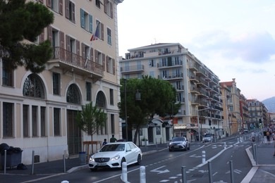 Photo of Nice, France - August 24, 2025: Picturesque view of buildings and cars on road in city