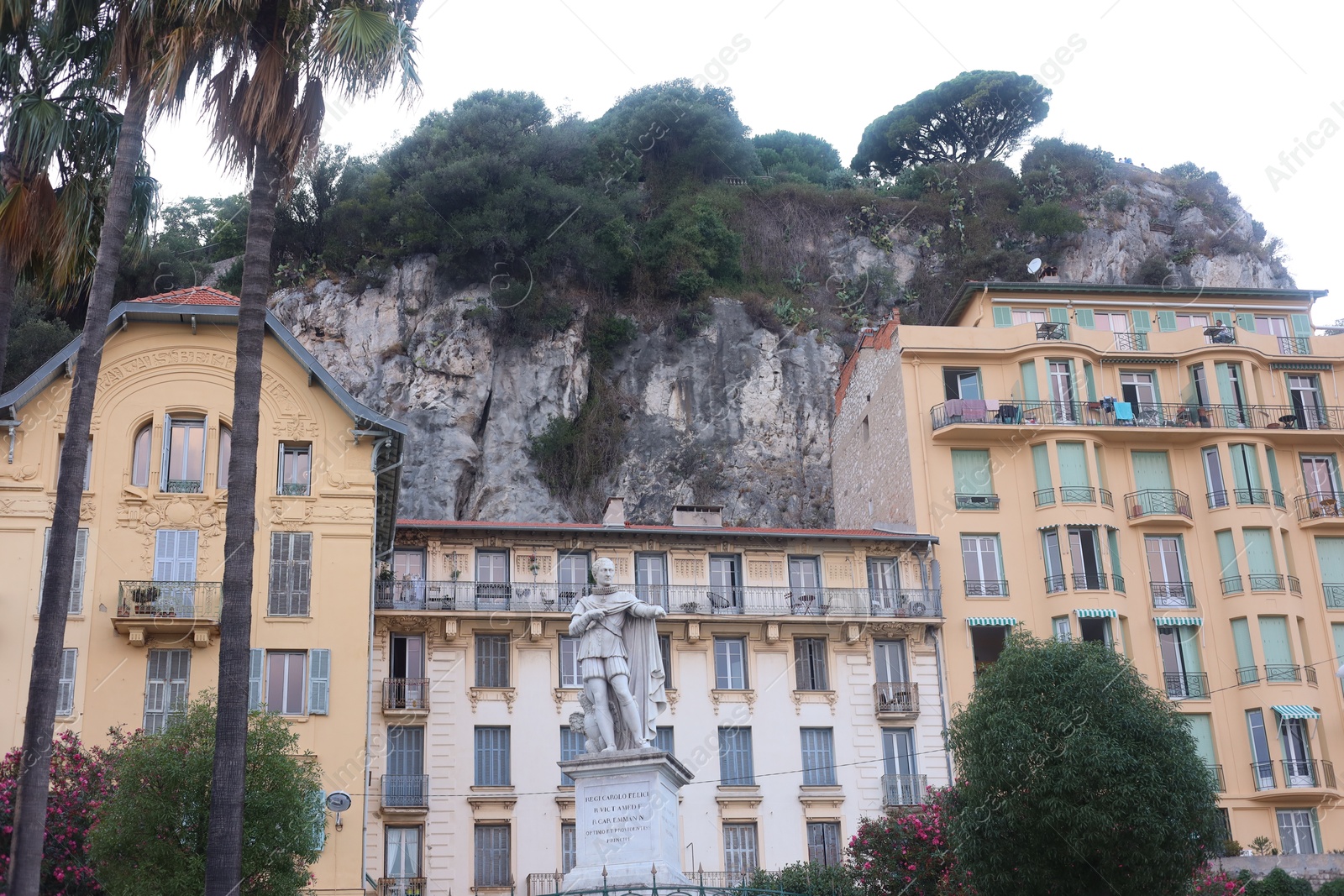 Nice, France - August 24, 2025: Beautiful building with windows and trees in city, low angle view Photo of Nice, France - August 24, 2025: Beautiful building with windows and trees in city, low angle view