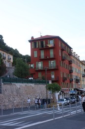 Photo of Nice, France - August 24, 2025: Picturesque view of buildings, road and parked cars in city