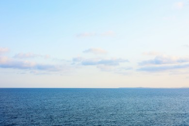 Photo of Beautiful view of wavy sea under blue cloudy sky
