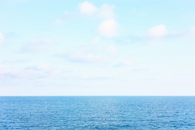 Photo of Beautiful view of wavy sea under blue cloudy sky