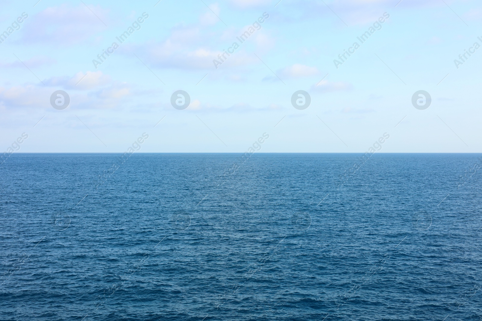 Photo of Beautiful view of wavy sea under blue cloudy sky