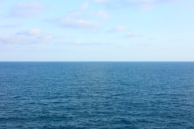 Photo of Beautiful view of wavy sea under blue cloudy sky