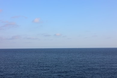 Photo of Beautiful view of wavy sea under blue cloudy sky