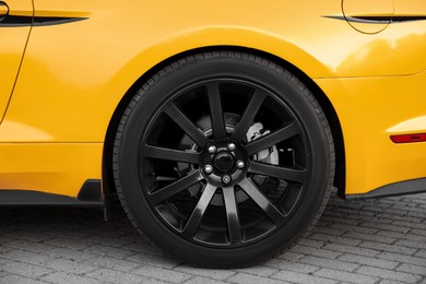 Photo of Modern cabriolet parked on parking lot outdoors, closeup