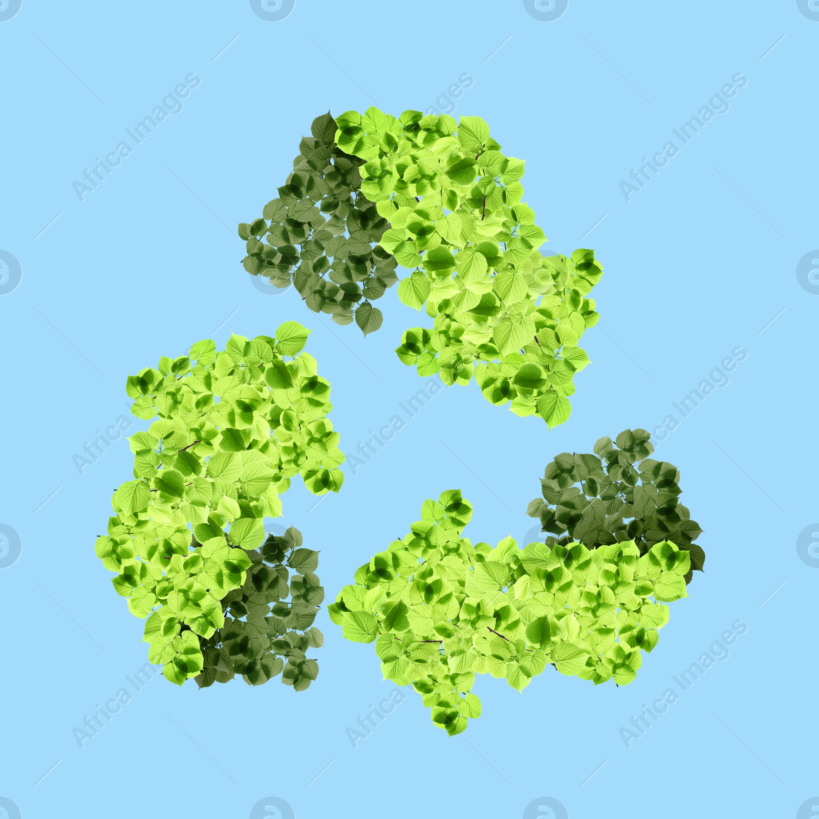 Image of Recycle sign. Chasing arrows with pattern of green leaves on light blue background