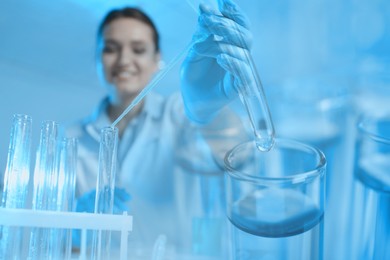 Image of Laboratory analysis. Scientist working with sample, double exposure with test tubes