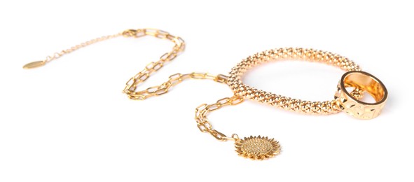 Photo of Many different gold jewelry isolated on white