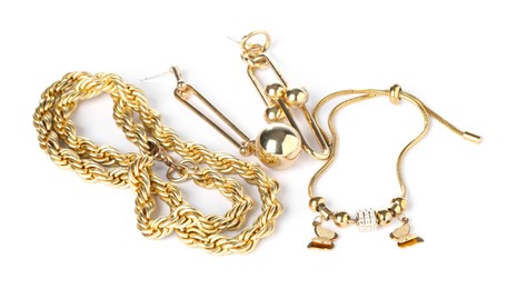 Photo of Many different gold jewelry isolated on white