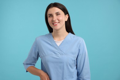 Photo of Nurse in uniform on light blue background