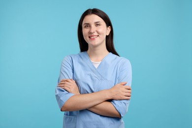 Photo of Nurse in uniform on light blue background