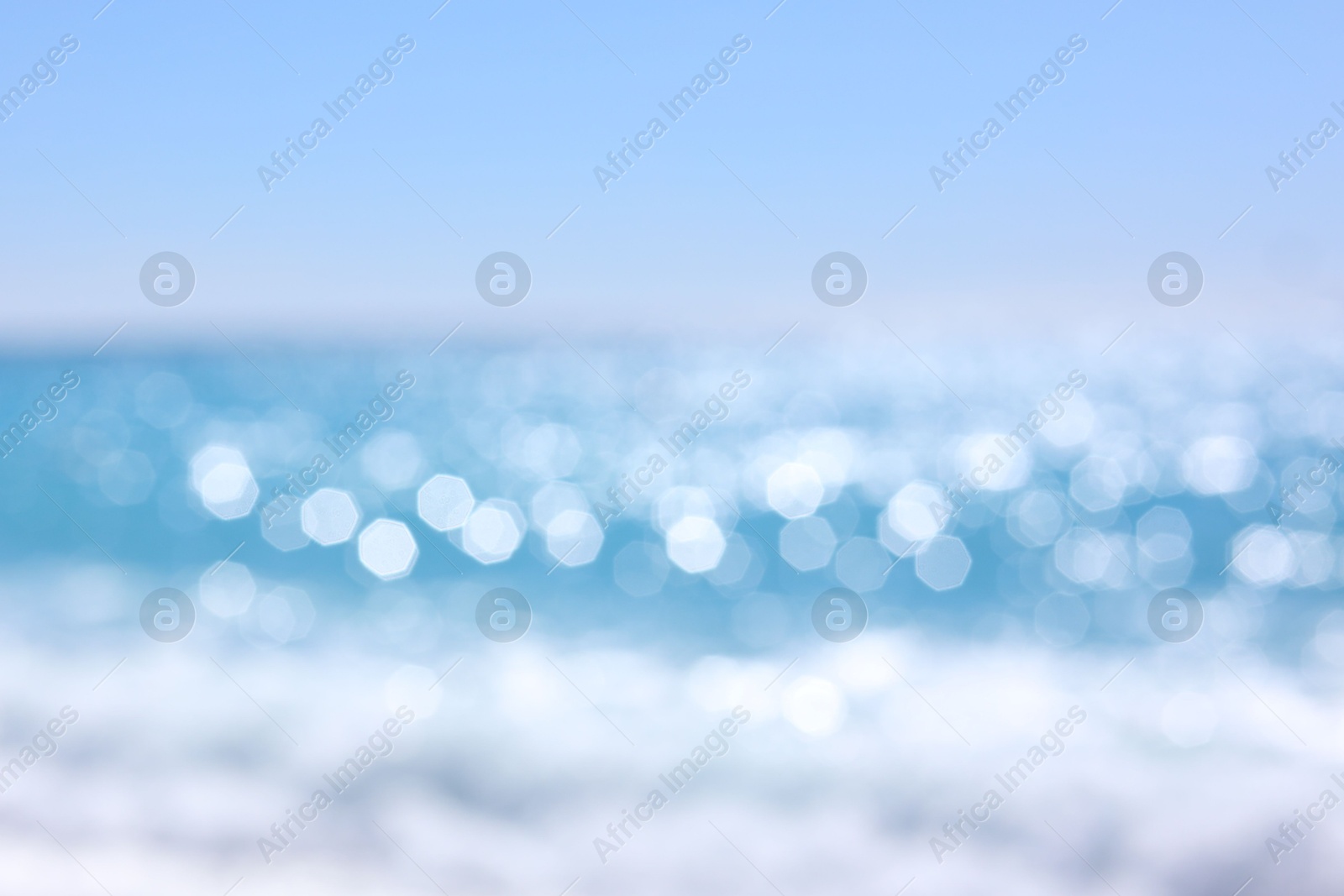 Photo of Blurred view of wavy sea and pebbles on beach