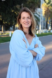Photo of Portrait of beautiful woman on city street