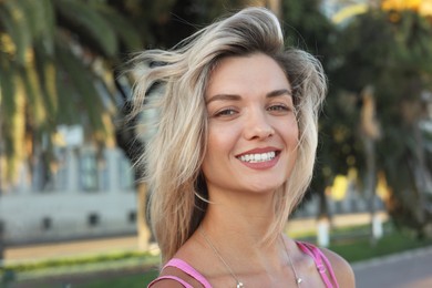 Photo of Portrait of beautiful woman on city street