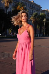 Photo of Portrait of beautiful woman on city street