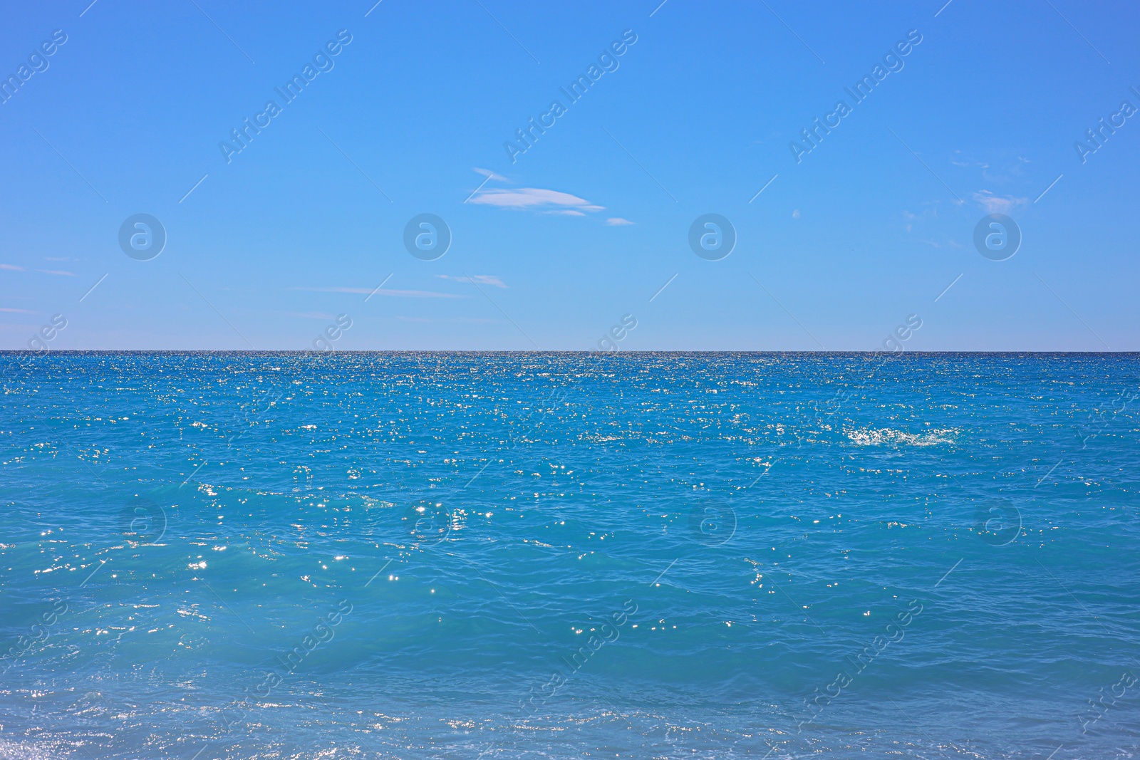 Photo of Beautiful view of wavy sea under blue sky