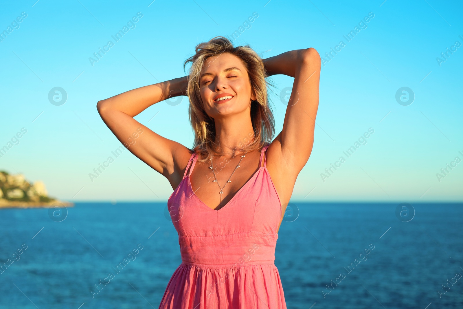 Photo of Beautiful woman near sea on summer day