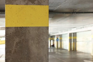 Photo of View of empty underground parking with dedicated spots