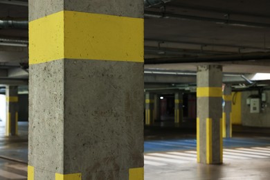 Photo of View of empty underground parking with dedicated spots