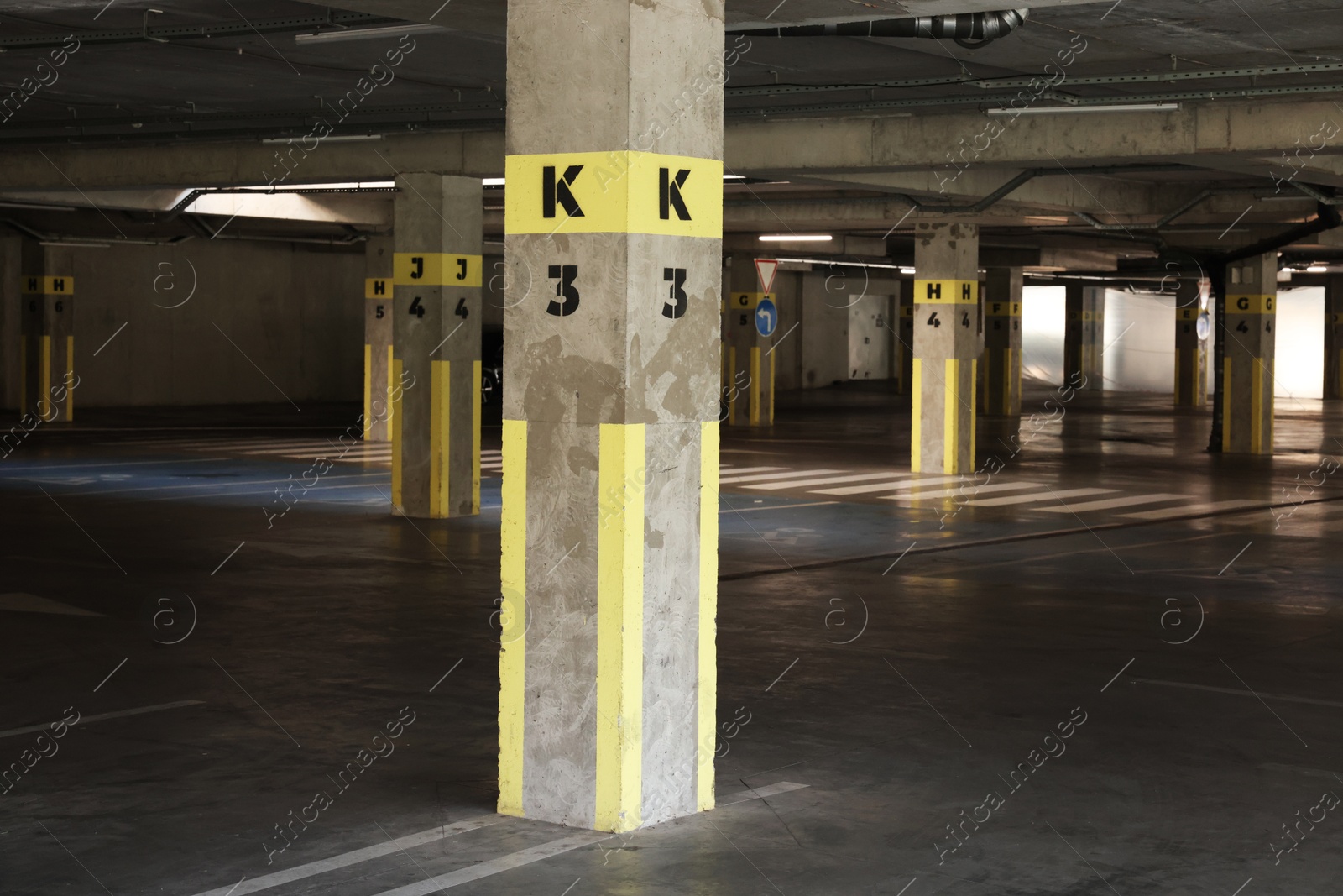 Photo of View of empty underground parking with dedicated spots