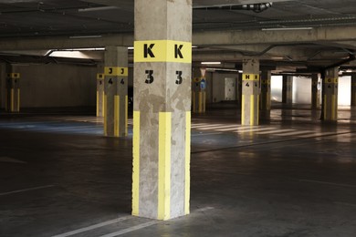 Photo of View of empty underground parking with dedicated spots