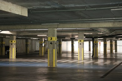 Photo of Underground parking with dedicated spots, pedestrian crossing and cars