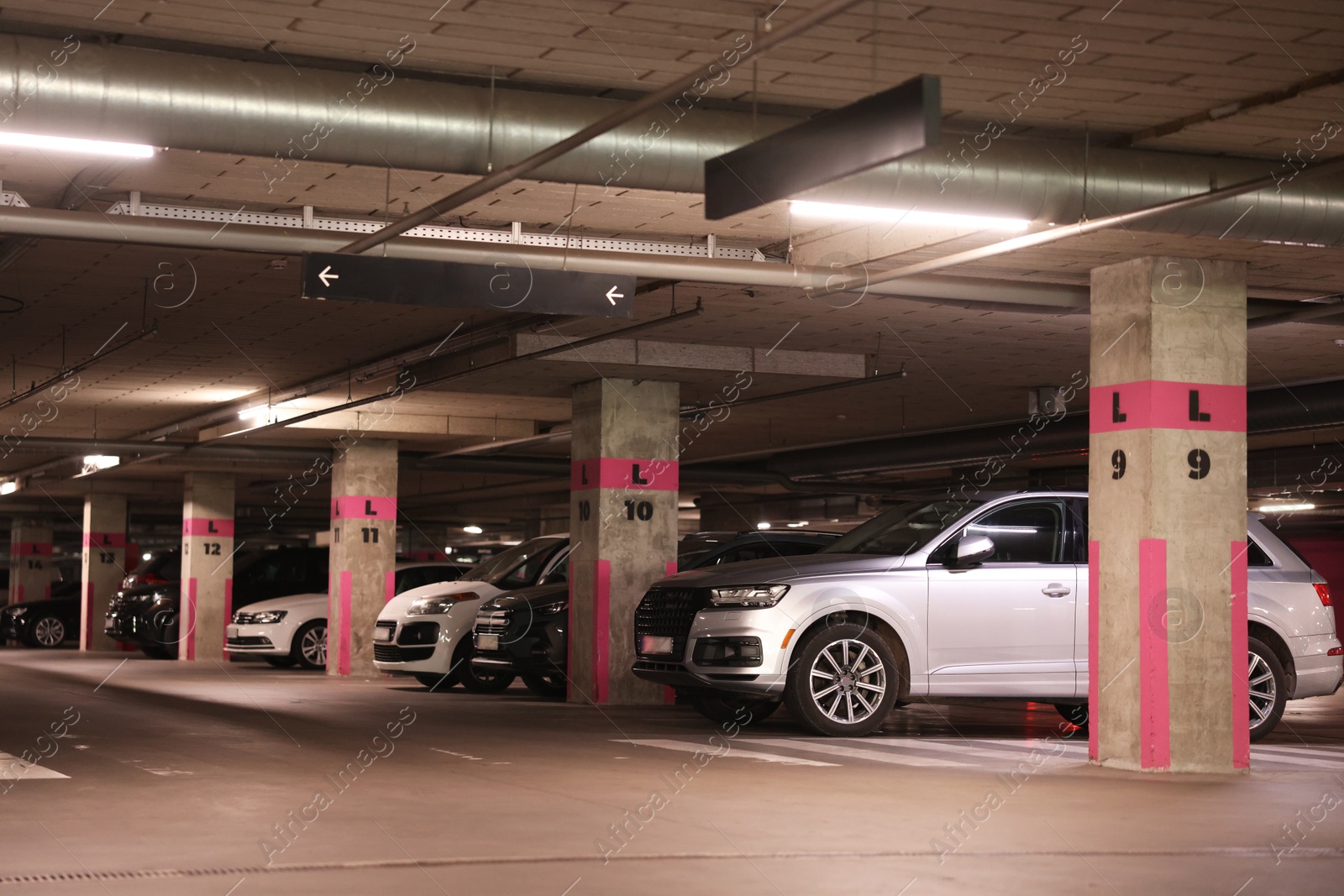 View of many cars in underground parking Photo of View of many cars in underground parking