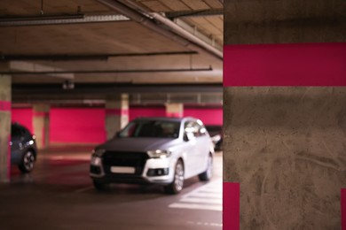 Photo of View of underground garage with parked cars