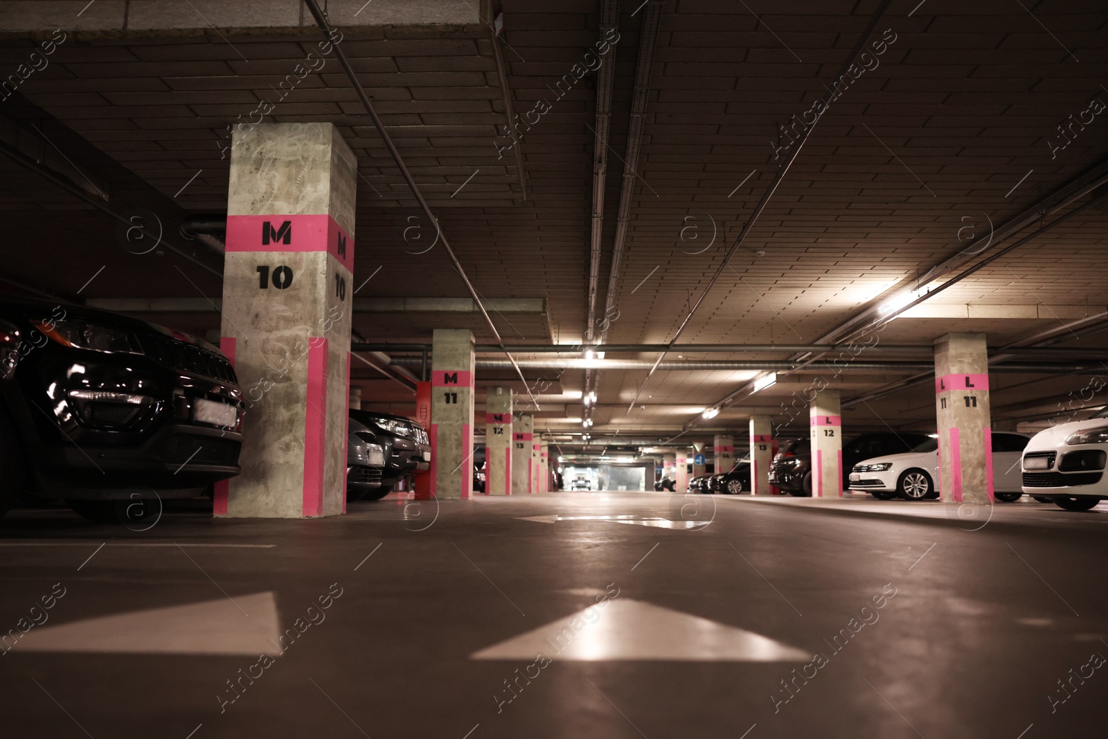 Photo of Many cars in underground parking, low angle view