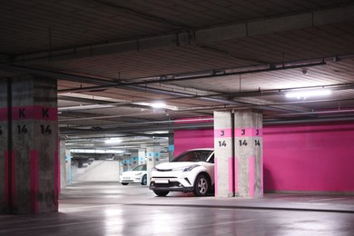 Photo of View of underground garage with parked cars