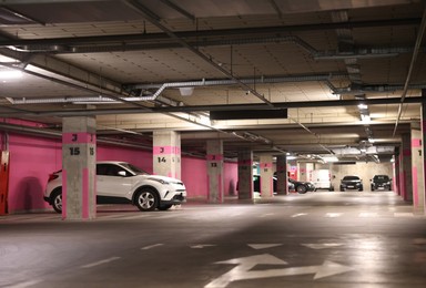 Photo of View of underground garage with parked cars