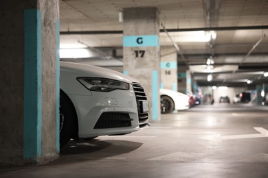 Photo of View of underground garage with parked cars