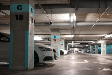 Photo of View of underground garage with parked cars