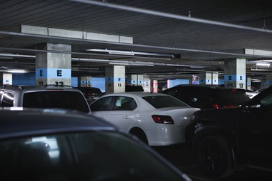 Photo of Many cars in underground parking, closeup view