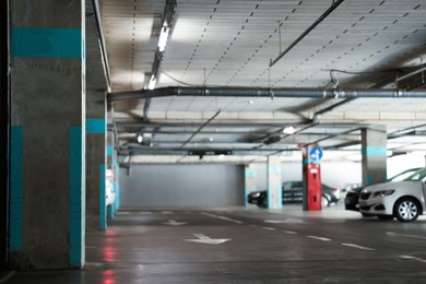 Photo of View of underground garage with parked cars