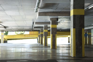 Photo of View of empty underground parking with dedicated spots
