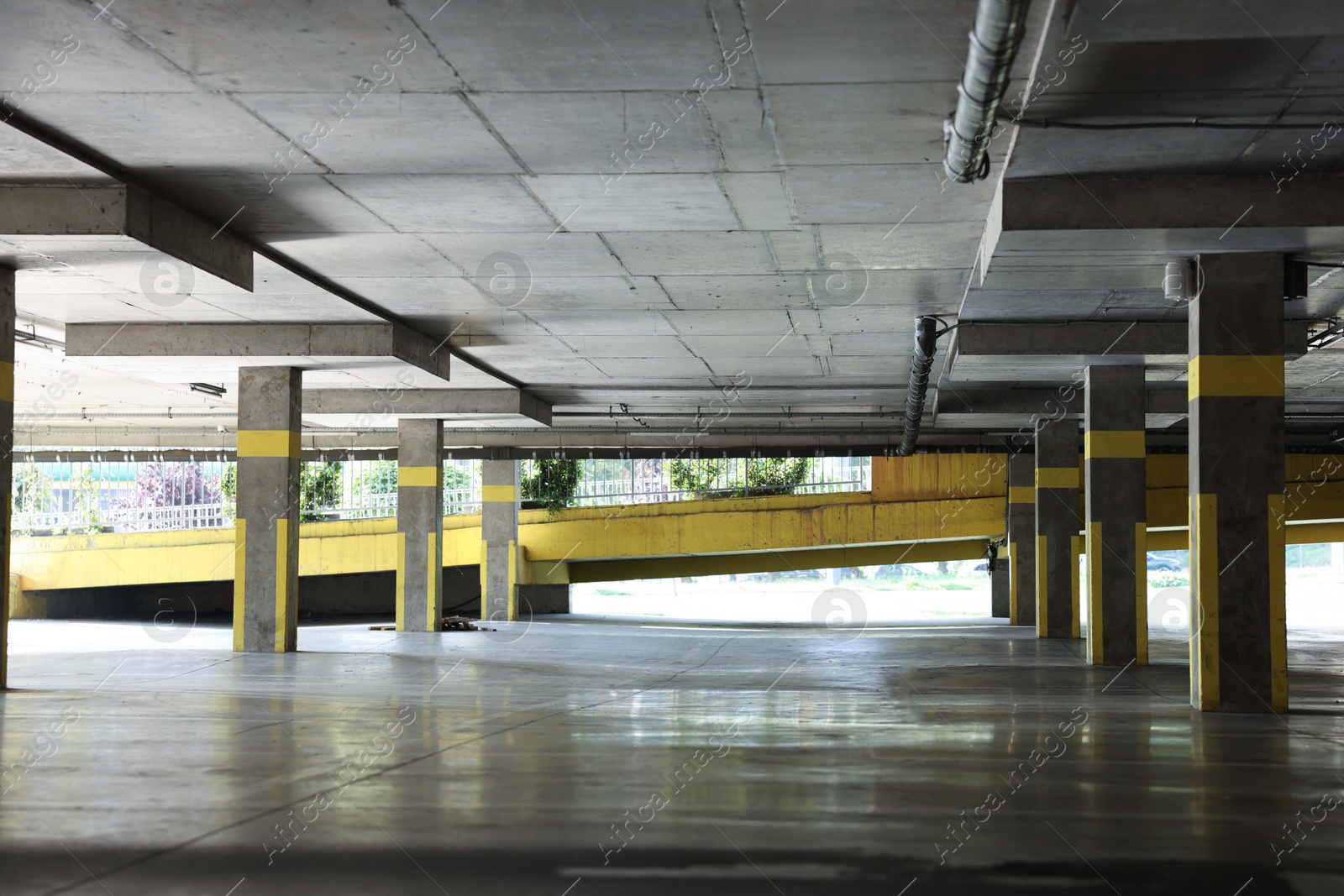 Photo of View of empty underground parking with dedicated spots