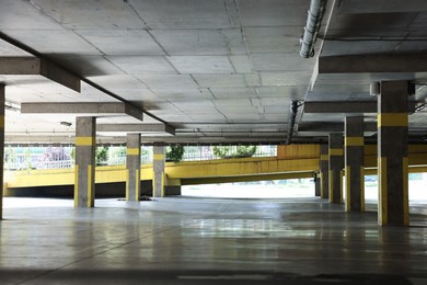 Photo of View of empty underground parking with dedicated spots