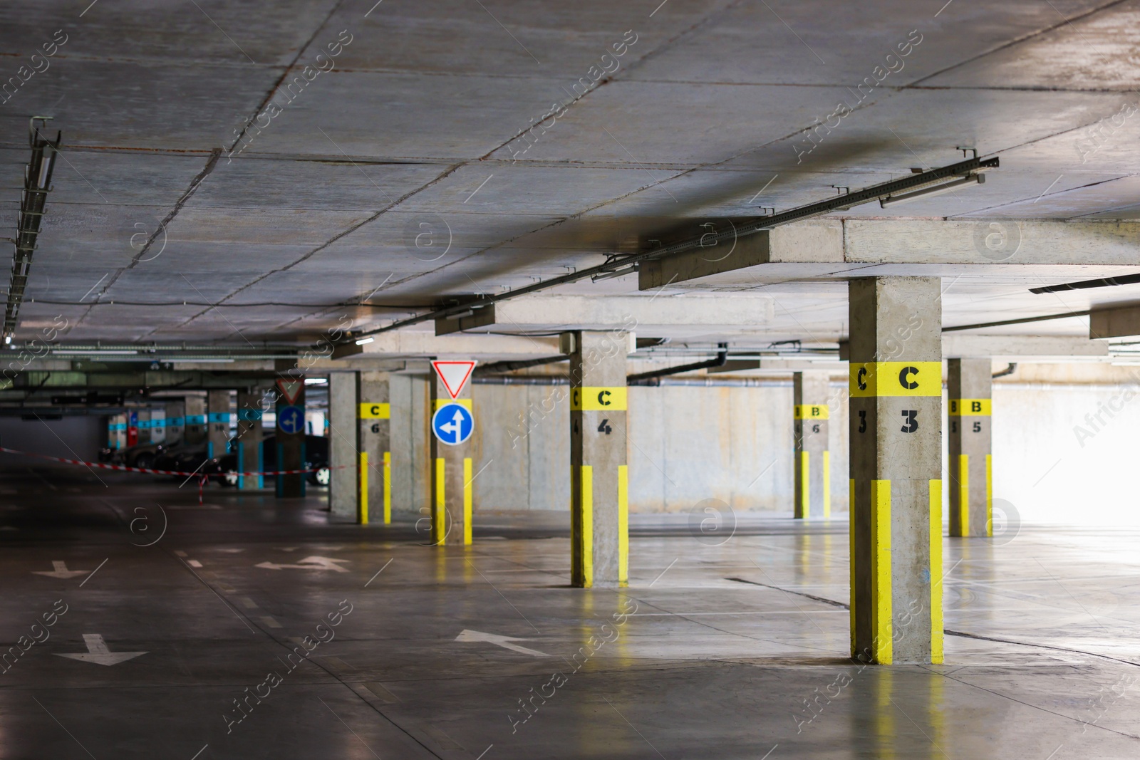 Photo of View of empty underground parking with dedicated spots