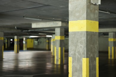 Photo of View of empty underground parking with dedicated spots