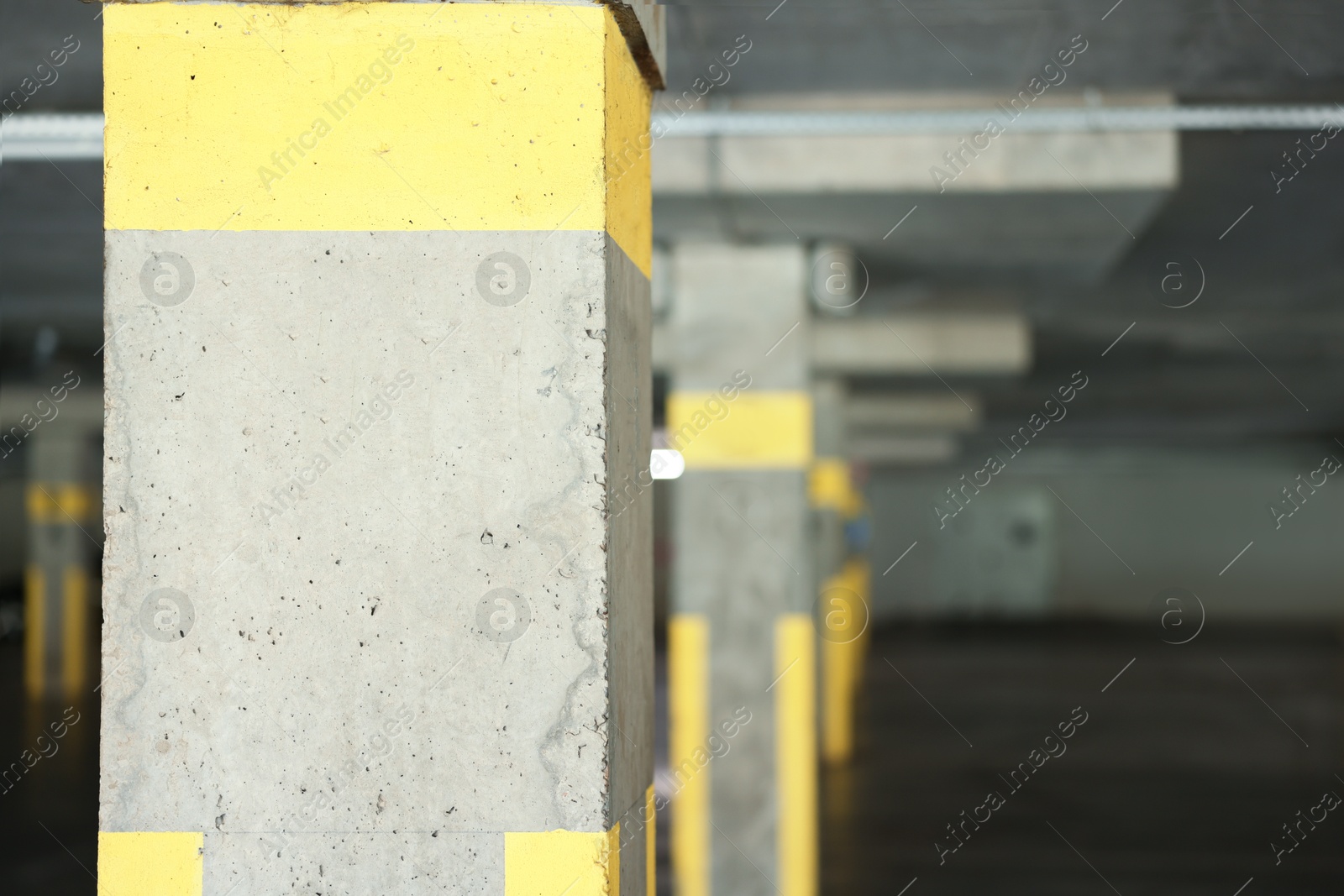 Photo of View of empty underground parking with dedicated spots