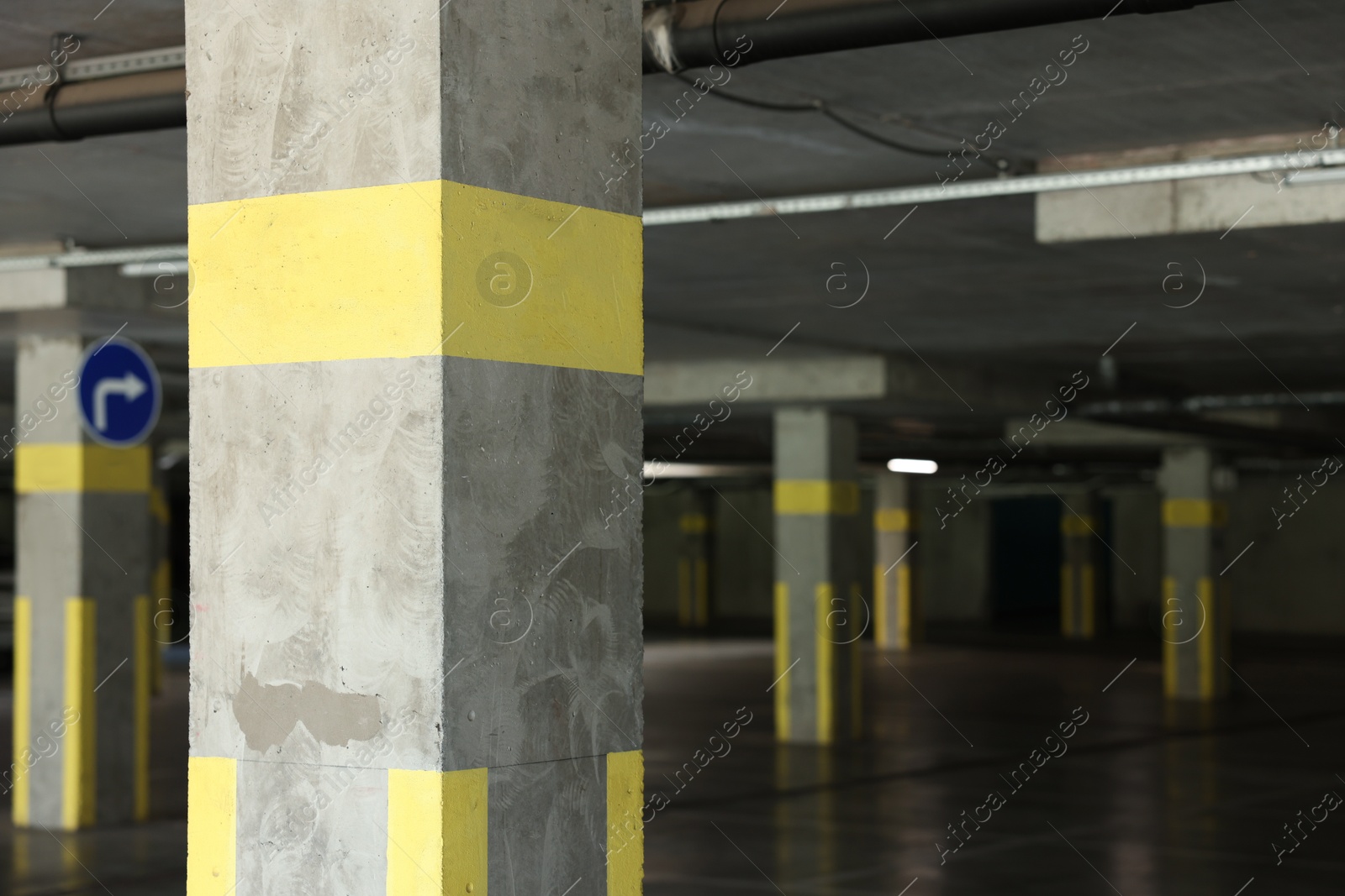 Photo of View of empty underground parking with dedicated spots
