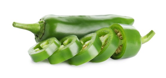 Photo of Whole and sliced green jalapeno peppers isolated on white