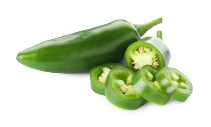 Photo of Whole and sliced green jalapeno peppers isolated on white