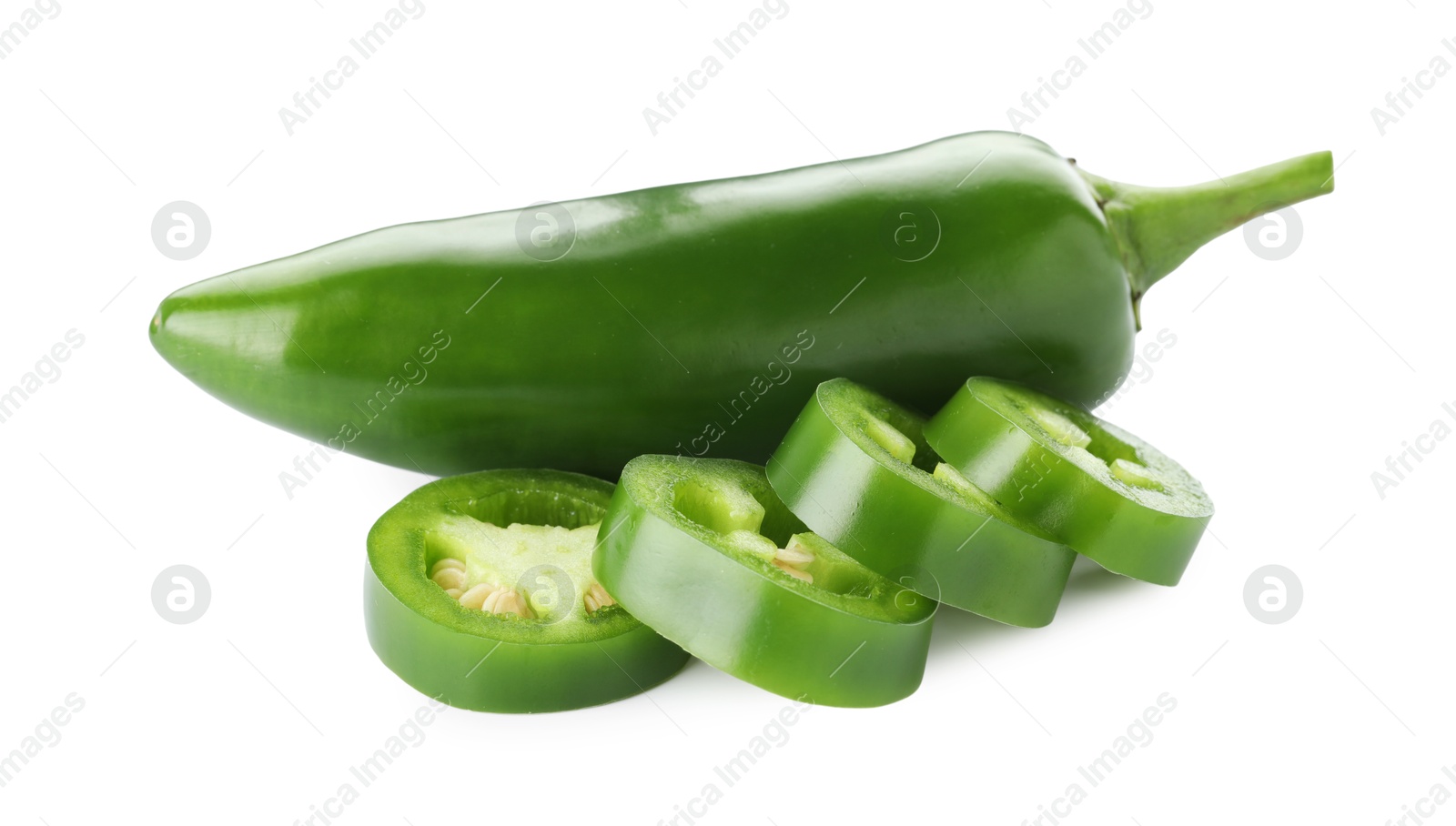 Photo of Whole and sliced green jalapeno peppers isolated on white