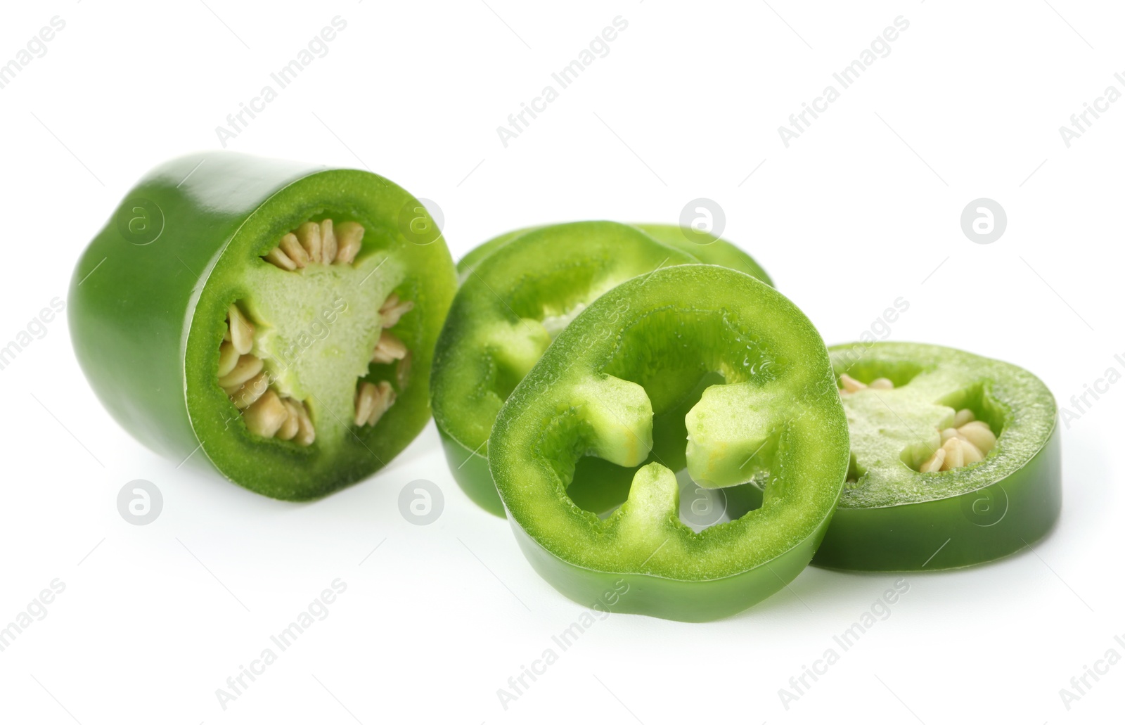 Photo of Slices of green jalapeno pepper isolated on white
