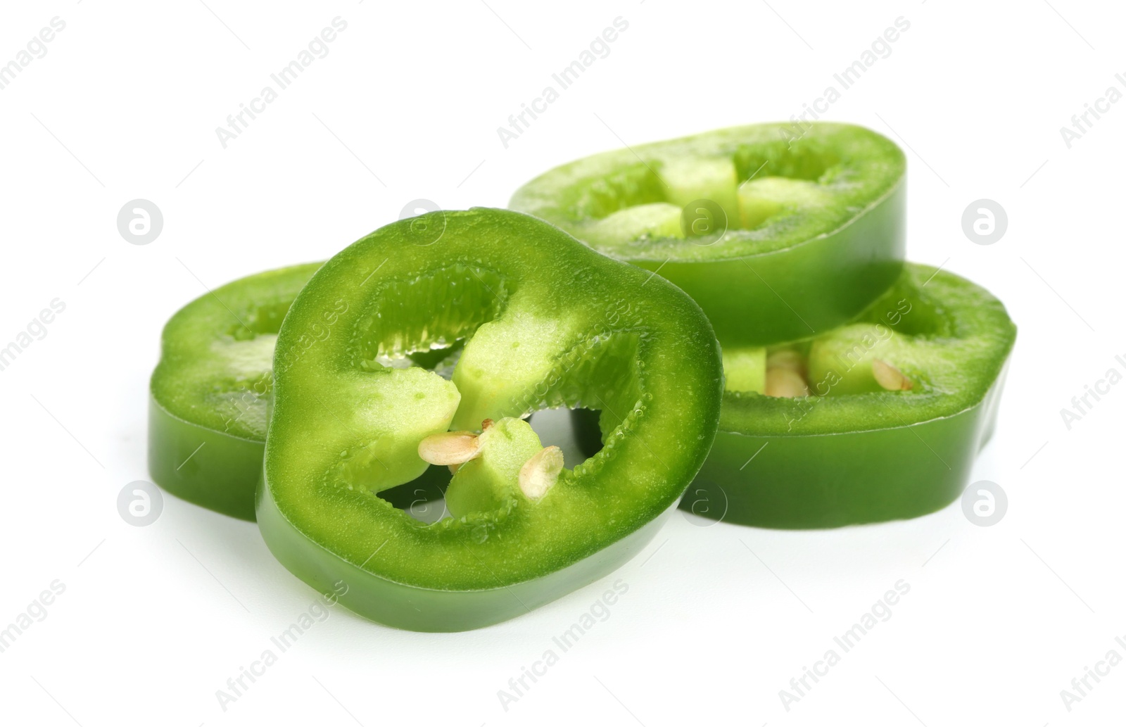 Photo of Slices of green jalapeno pepper isolated on white