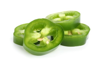 Photo of Slices of green jalapeno pepper isolated on white