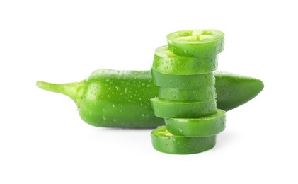 Photo of Whole and sliced green jalapeno peppers isolated on white