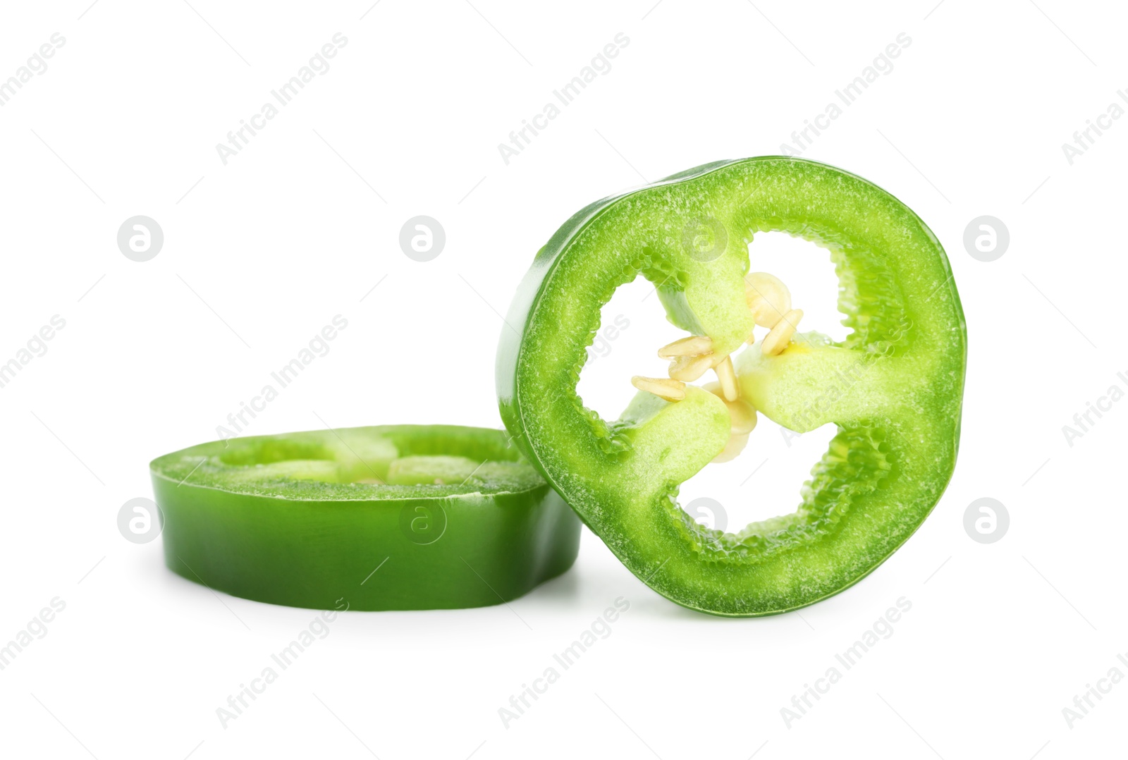 Photo of Slices of green jalapeno pepper isolated on white